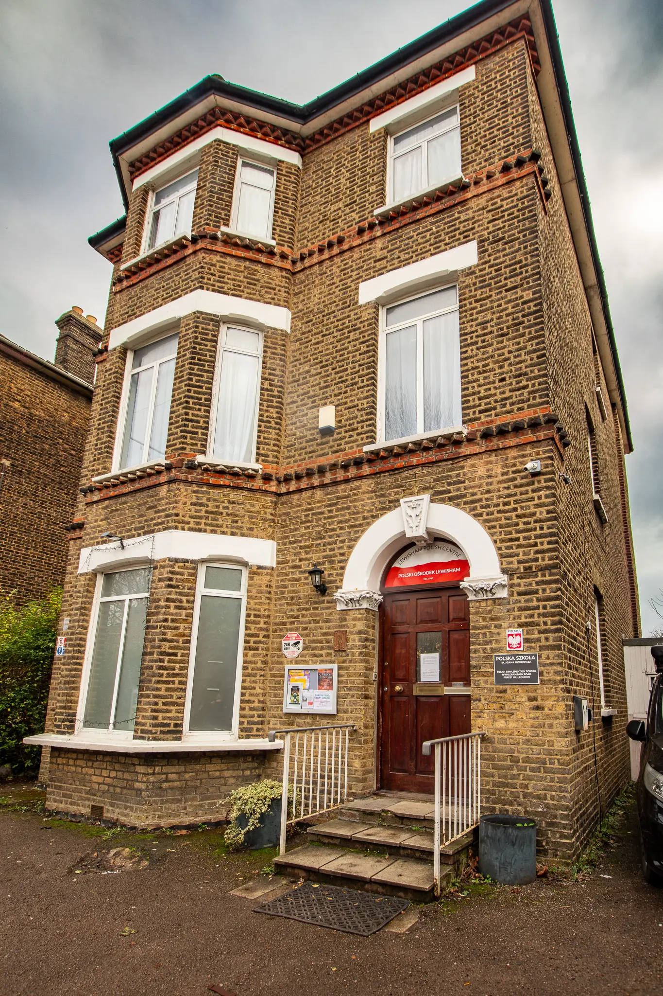Professional exterior front elevation photography of a brick residential building in South East London